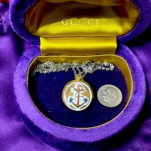 Authentic Gucci case and dust bag with a button made into a necklace. 5 star